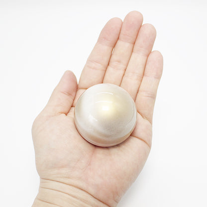 木星をイメージしたミニ骨壷：片手に乗る小さなサイズのミニ骨壷。ぎゅっと握りしめられる分骨用のお骨壷です。